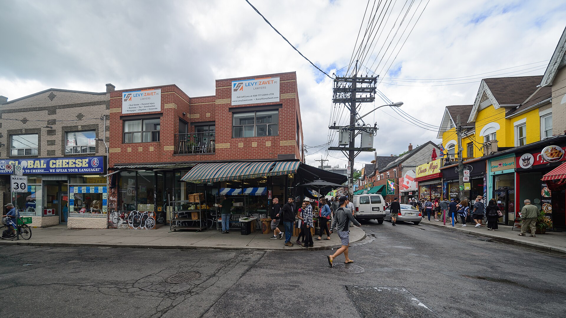 Colourful shopfronts and street produce stalls in Kensington Market, Toronto
