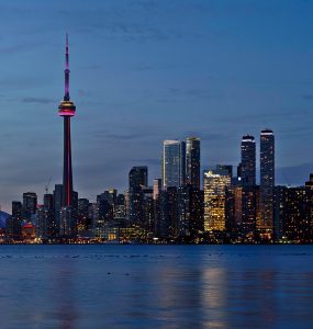 Toronto skyline at sunset seen across Lake Ontario