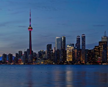 Toronto skyline at sunset seen across Lake Ontario