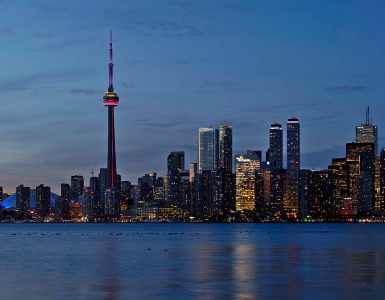 Toronto skyline at sunset seen across Lake Ontario