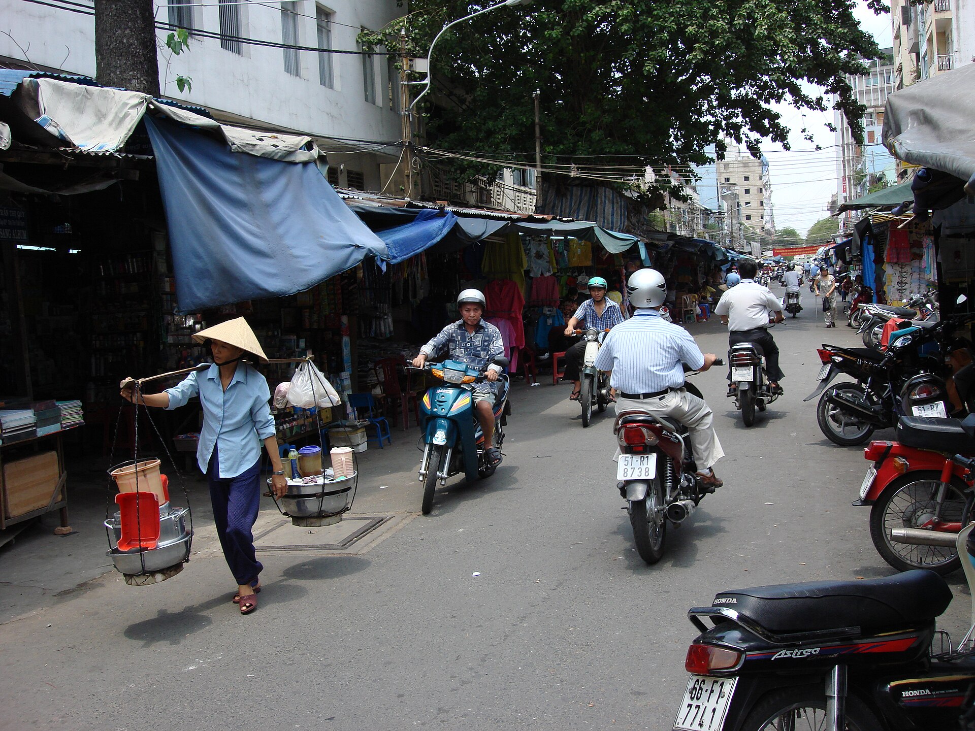 Parked motorbikes crowding a pavement in Ho Chi Minh City