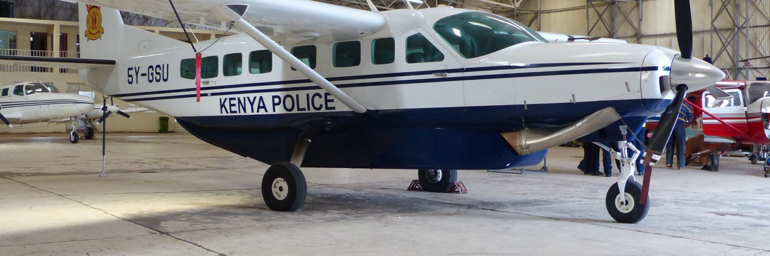 A Cessna 208 Caravan, the same aircraft type used on most Kenyan safari routes, parked at Nairobi's Wilson Airport