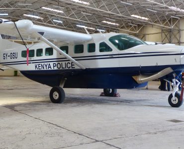 A Cessna 208 Caravan, the same aircraft type used on most Kenyan safari routes, parked at Nairobi's Wilson Airport