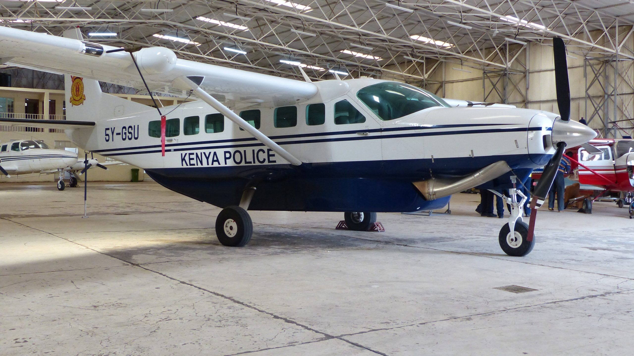 A Cessna 208 Caravan, the same aircraft type used on most Kenyan safari routes, parked at Nairobi's Wilson Airport
