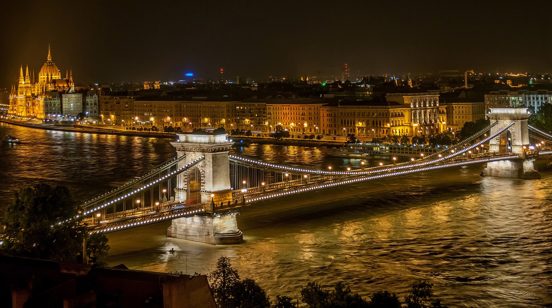 The illuminated Szechenyi Chain Bridge spanning the Danube between Buda and Pest at night