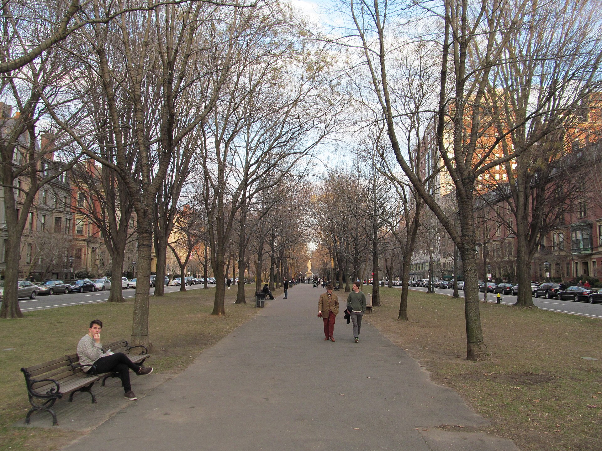 The tree-lined central promenade of Commonwealth Avenue Mall running through Boston's Back Bay