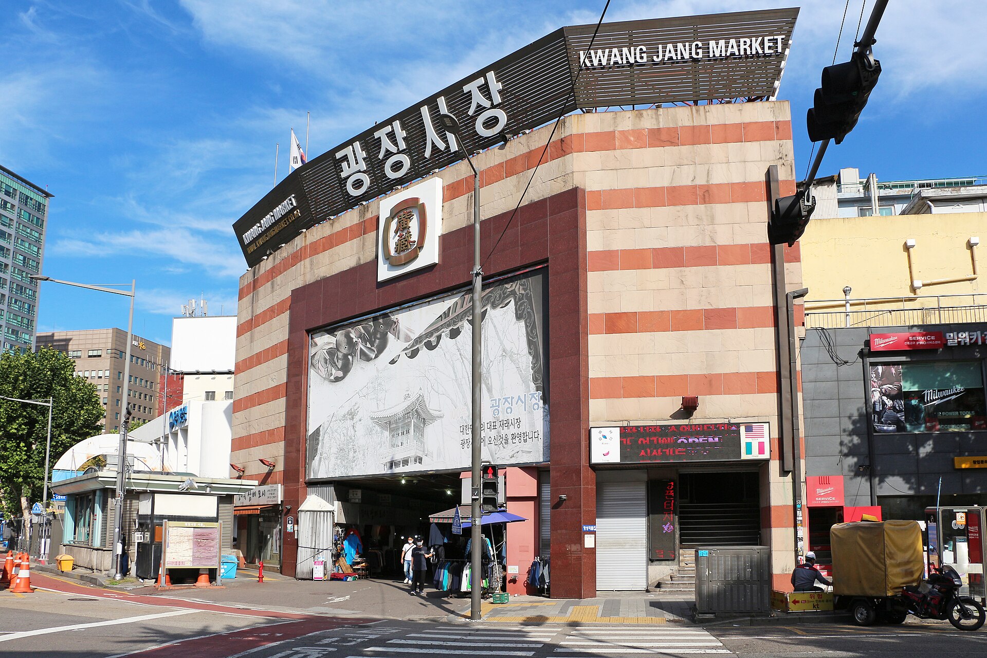 Food stalls and seated diners inside Gwangjang Market in central Seoul