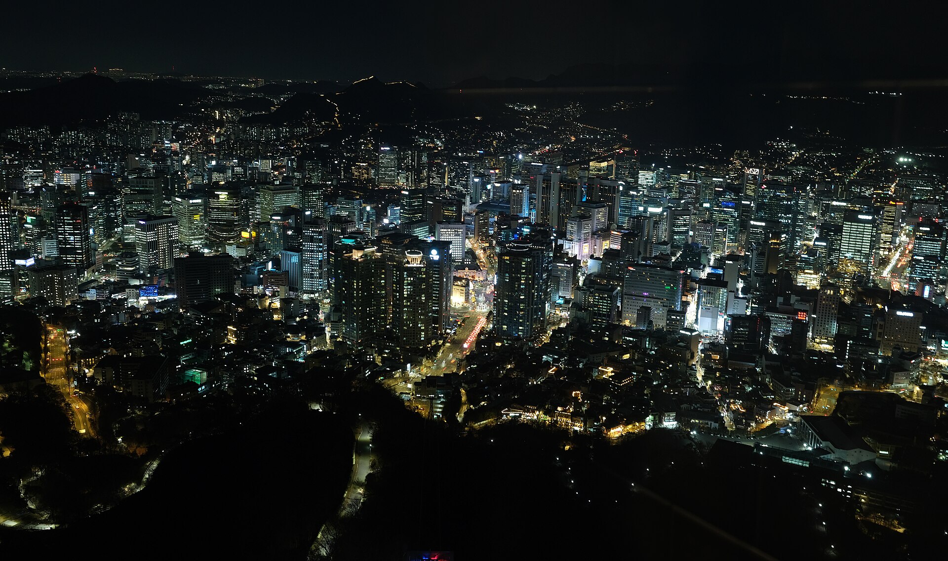 N Seoul Tower rising above the wooded slopes of Namsan in central Seoul