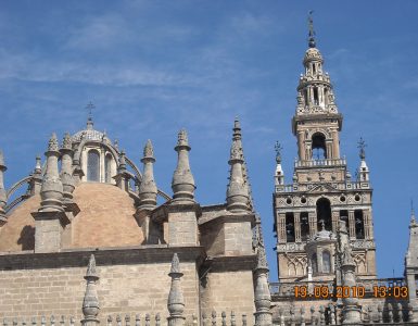 Seville Cathedral and the Giralda bell tower seen from the street