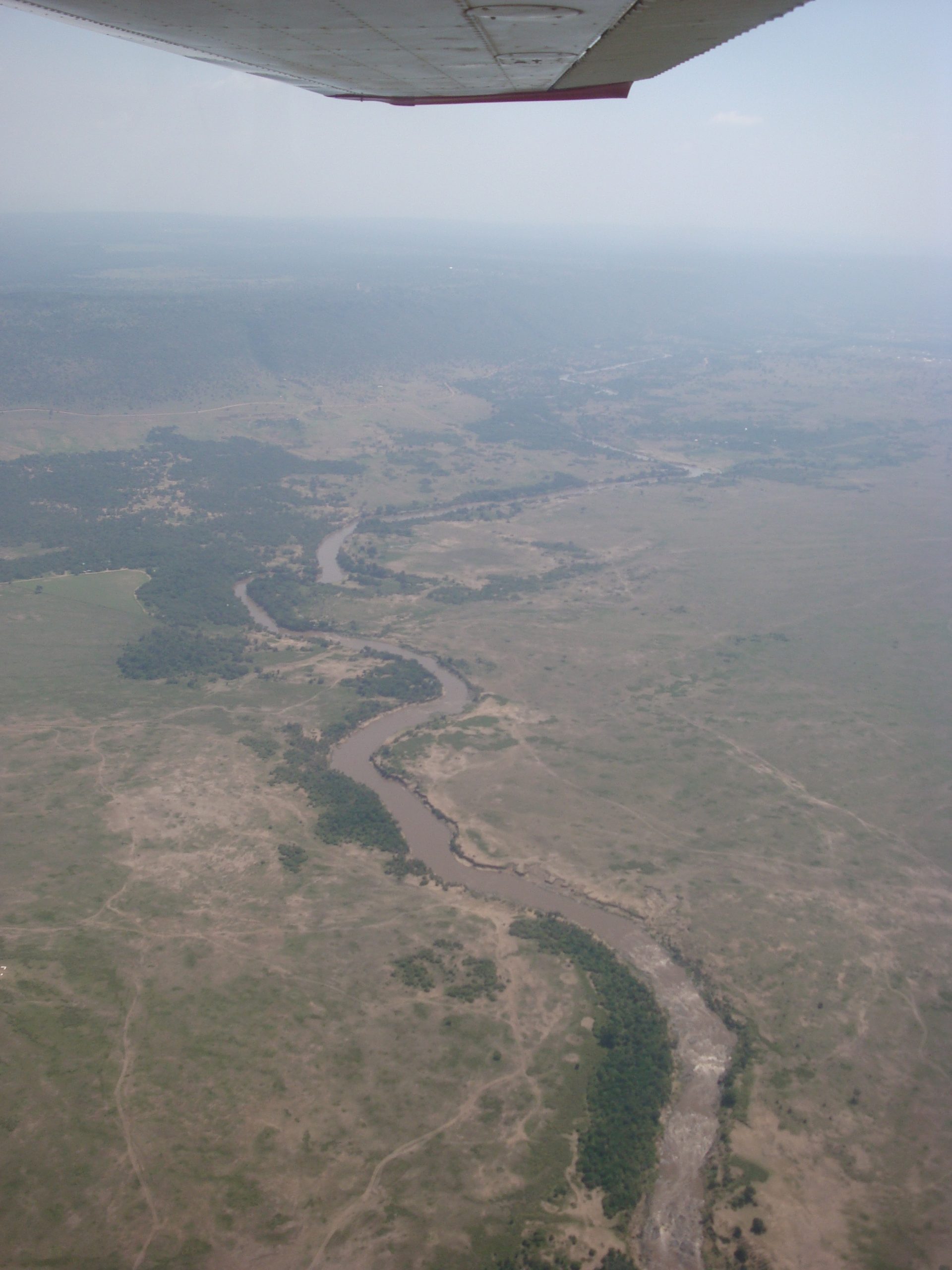 View from a small Cessna aircraft over the savannah on the route from Nairobi to the Maasai Mara, Kenya