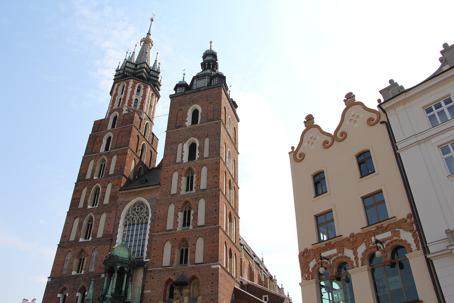 The two uneven brick towers of St Mary’s Basilica on Krakow’s Main Market Square