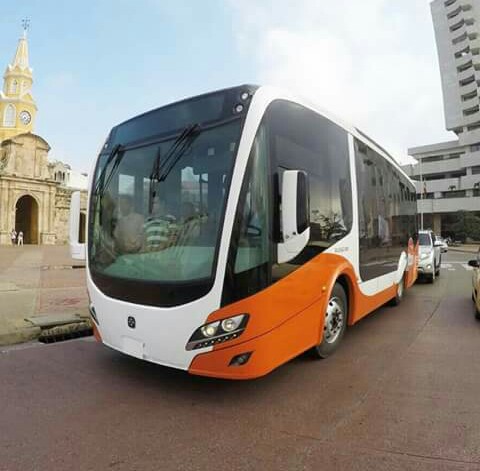 A Transcaribe feeder bus on a street in Cartagena, Colombia