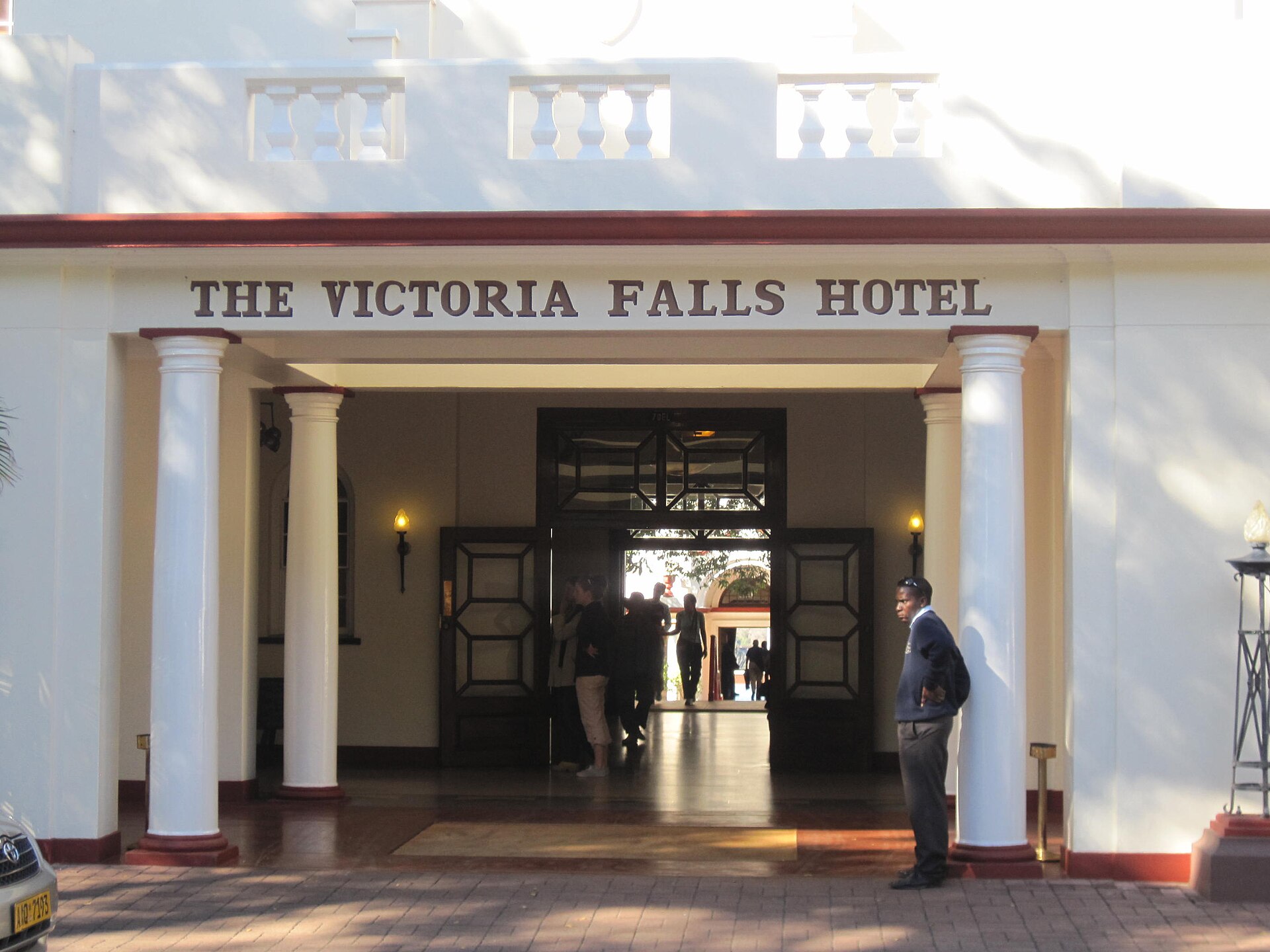 Colonial-era facade and entrance driveway of the Victoria Falls Hotel in Zimbabwe