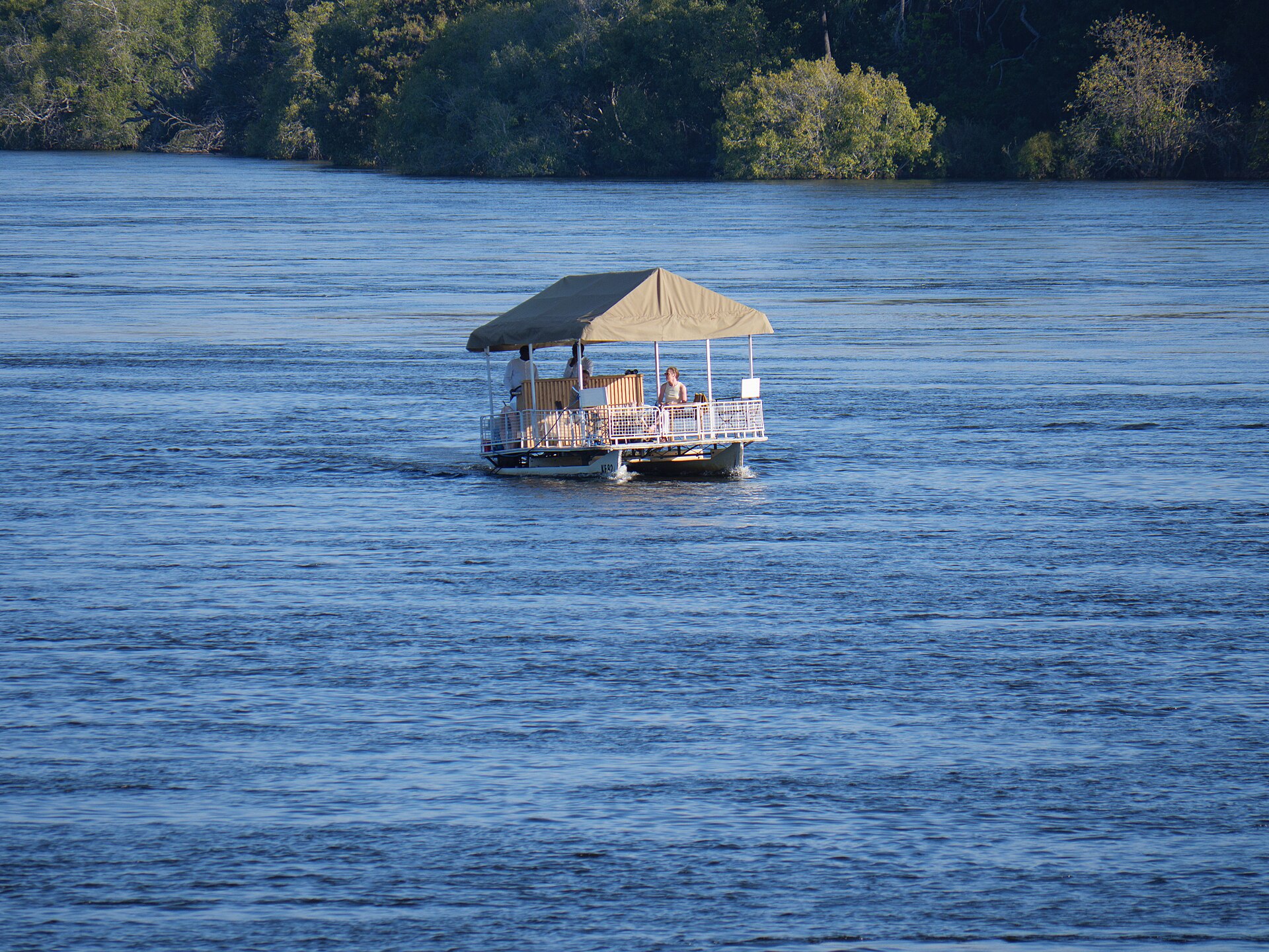Sunset cruise boat on the Zambezi River upstream of Victoria Falls near Livingstone