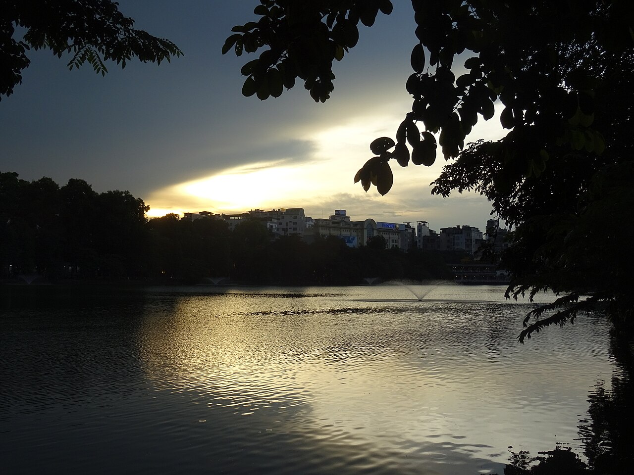 Hoan Kiem Lake surrounded by trees in the Old Quarter of Hanoi, Vietnam